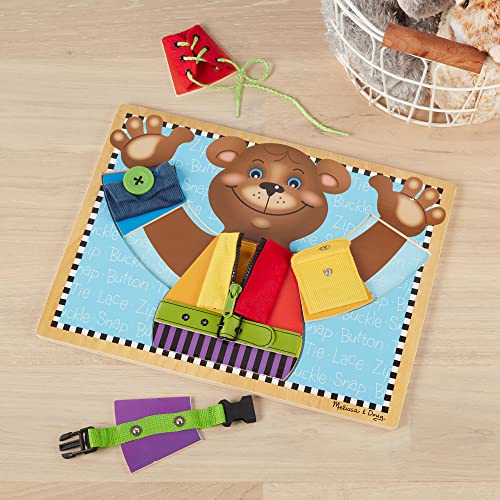 Melissa and Doug Basic Skills Puzzle Board - Wooden Educational Toy - Learn To Button Busy Board, Activity Board For Fine Motor Skills, Developmental Toy For Toddlers Ages 3+