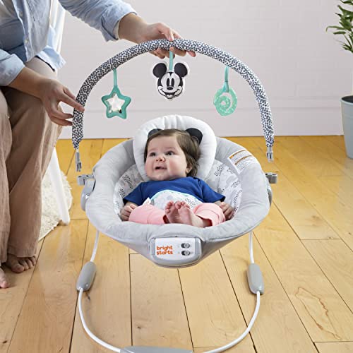 MICKEY MOUSE Comfy Disney Baby Bouncer in Cloudscapes Includes Toy Bar with 3 Cute Toys, Plays 7 Soothing Melodies w/Auto Shut-Off, Age 0-6 Months